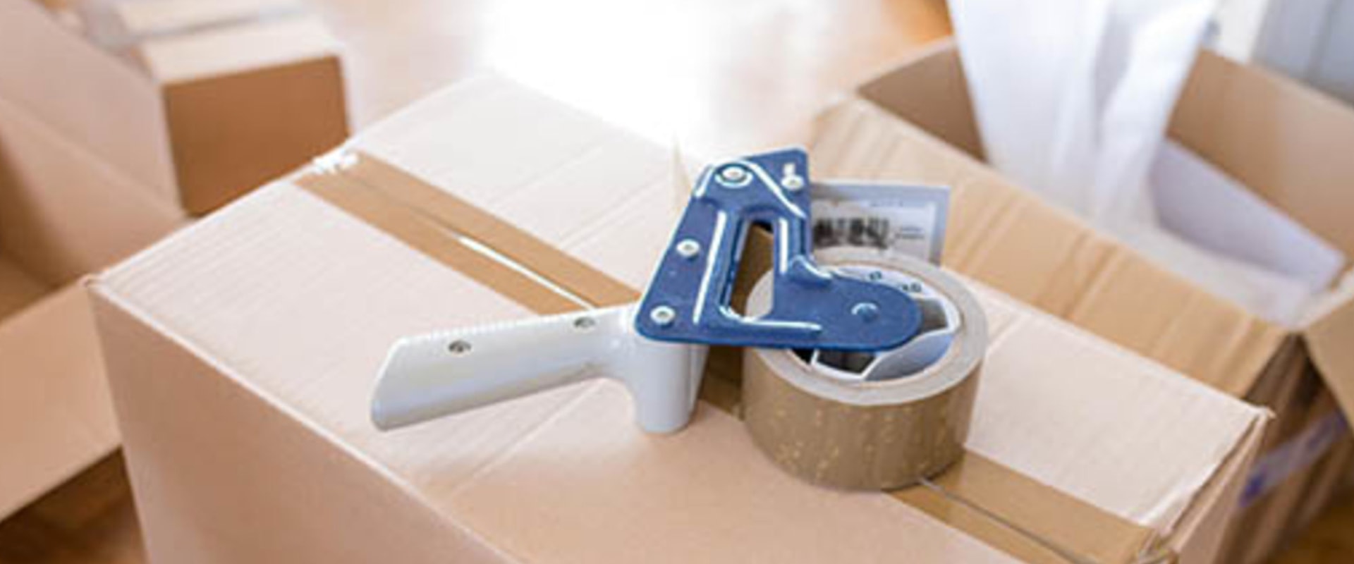 What are the best ways to find affordable packing materials for a house move?